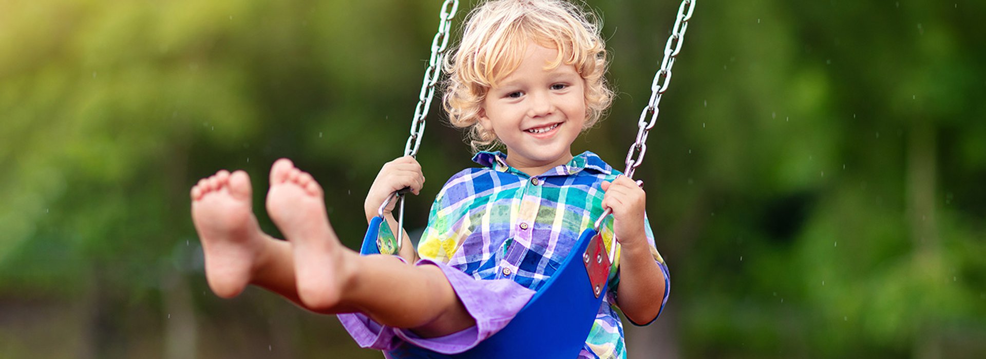 Child-on-playground.-swing-Kids-play-outdoor